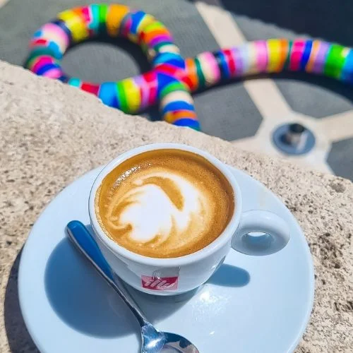 cute cup of coffee in colorful location