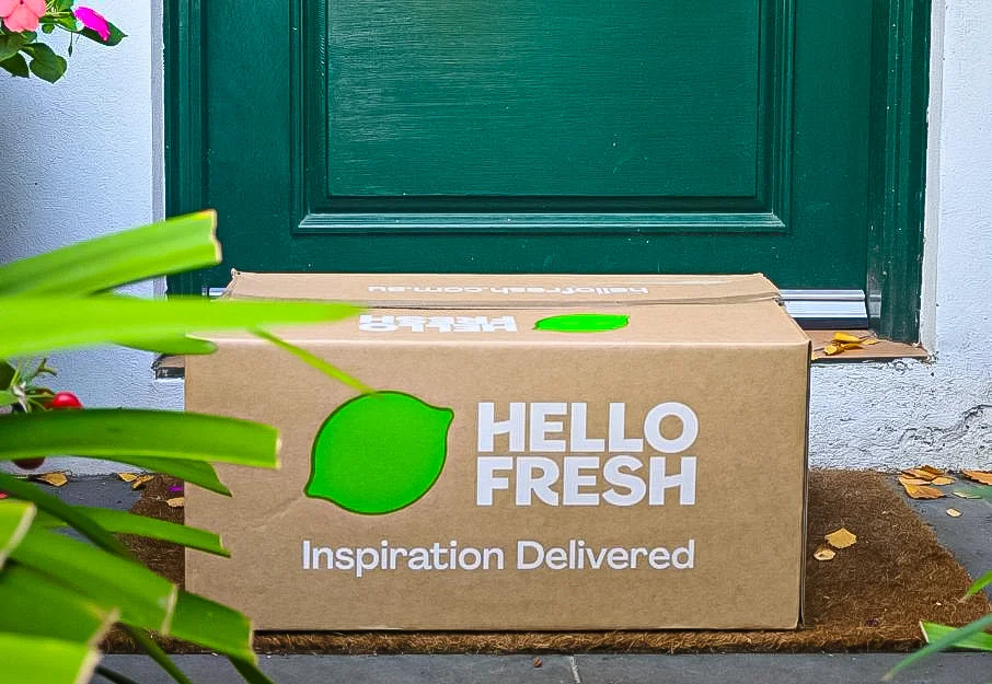 Hello Fresh food box sitting at green door