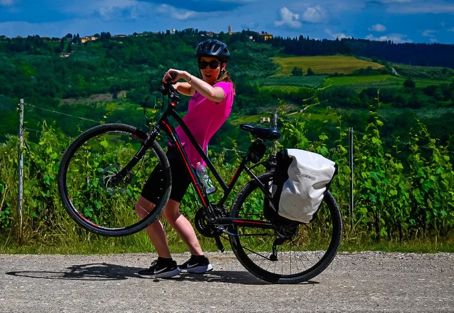 Lady doing a wheelie in Tuscany after leaving luggage at Radical Storage