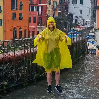 Eva wearing a yellow jacket in the rain in Cinque Terre