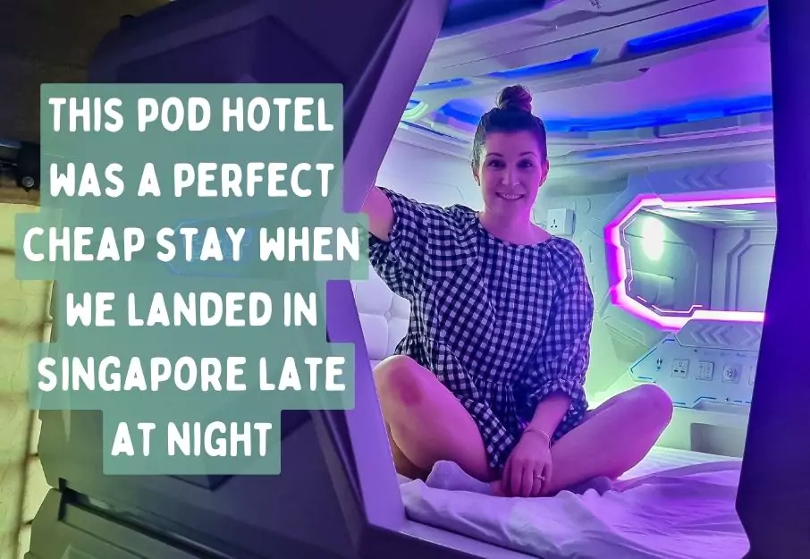 Eva sitting in a pod hotel in Singapore