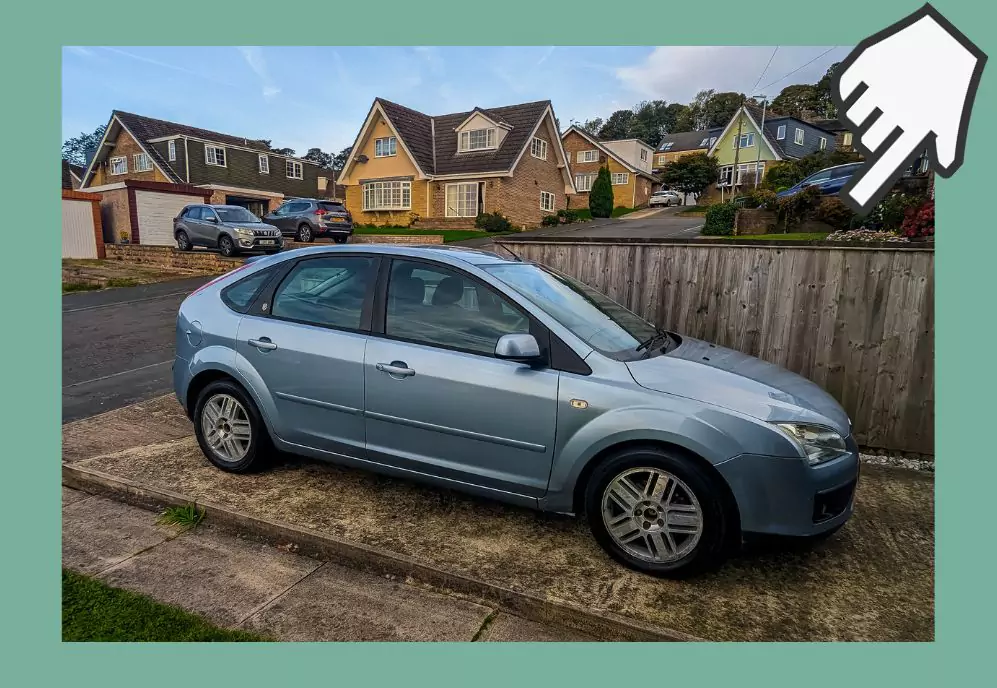 A blue ford focus that we purchased in the UK as non-residents on a driveway