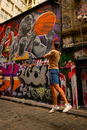 Tim jumping for photo in Melbourne Alleyway