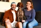 Couple sitting with a brown dog that they looked after while house sitting 