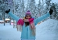 Woman with hands up in excitement at being in Rovaniemi for Christmas