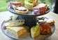 A high tea with both savoury and sweet treats set up at a hotel for a couples date night.